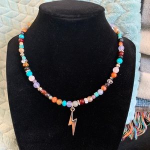 Assorted beads necklace with lighting bolt charm